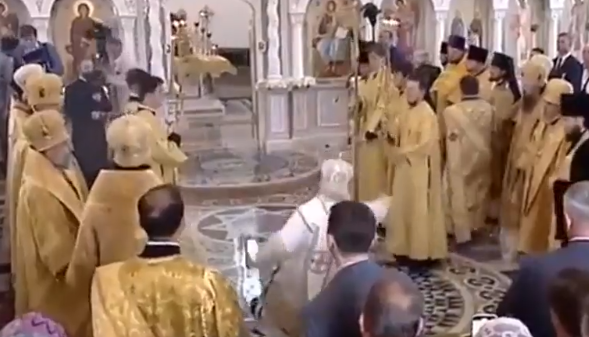 Patriarch slips on holy water during the service
